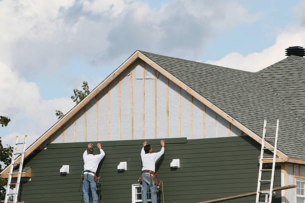 Professional Storm Damage Siding Repair technician working in Montgomery, IN